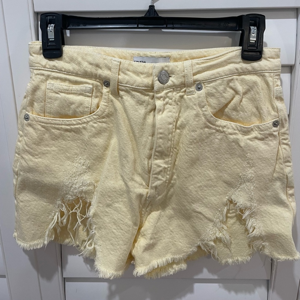 Pastel yellow denim shorts